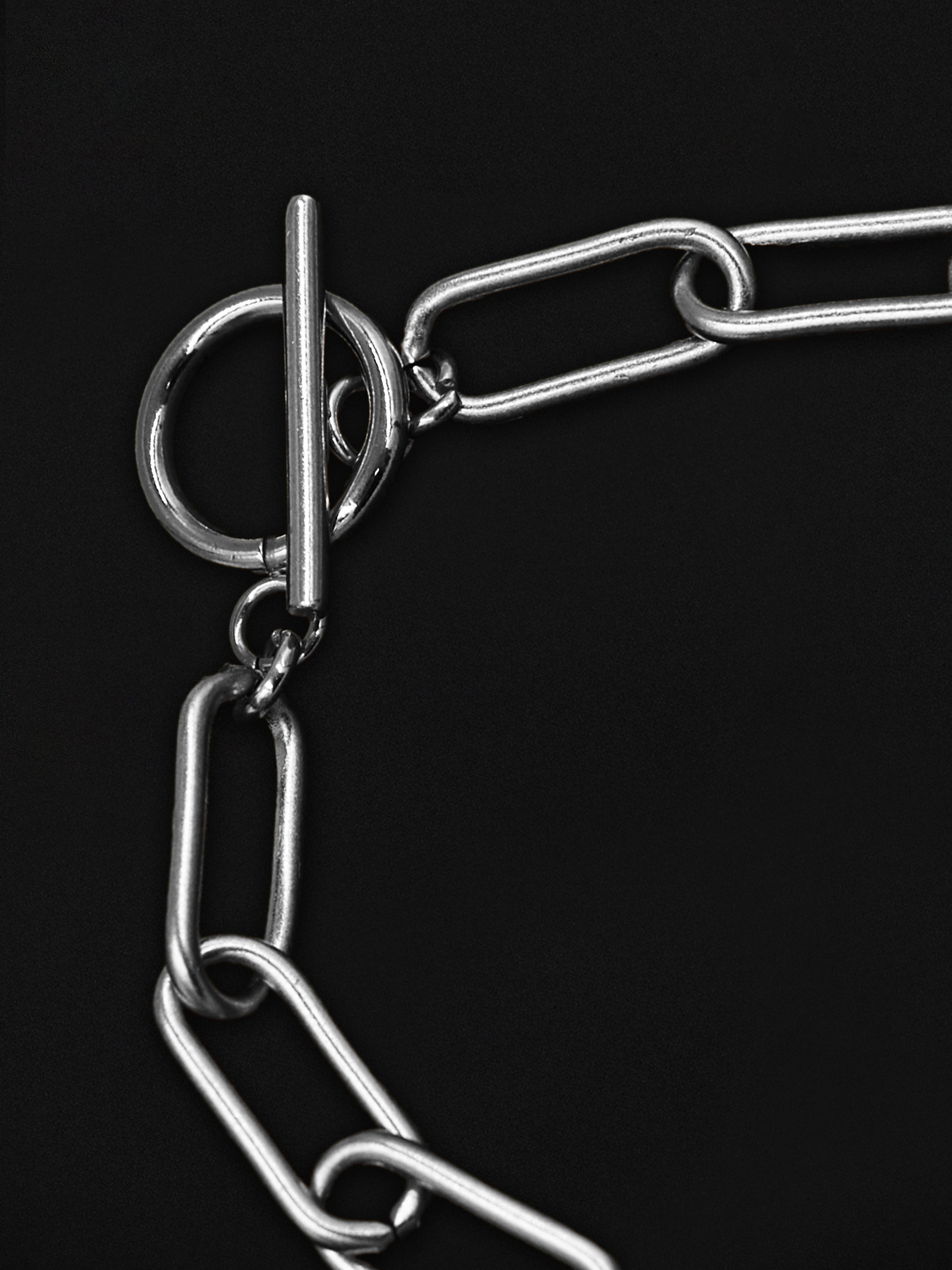 Close-up of a metal chain on a black background