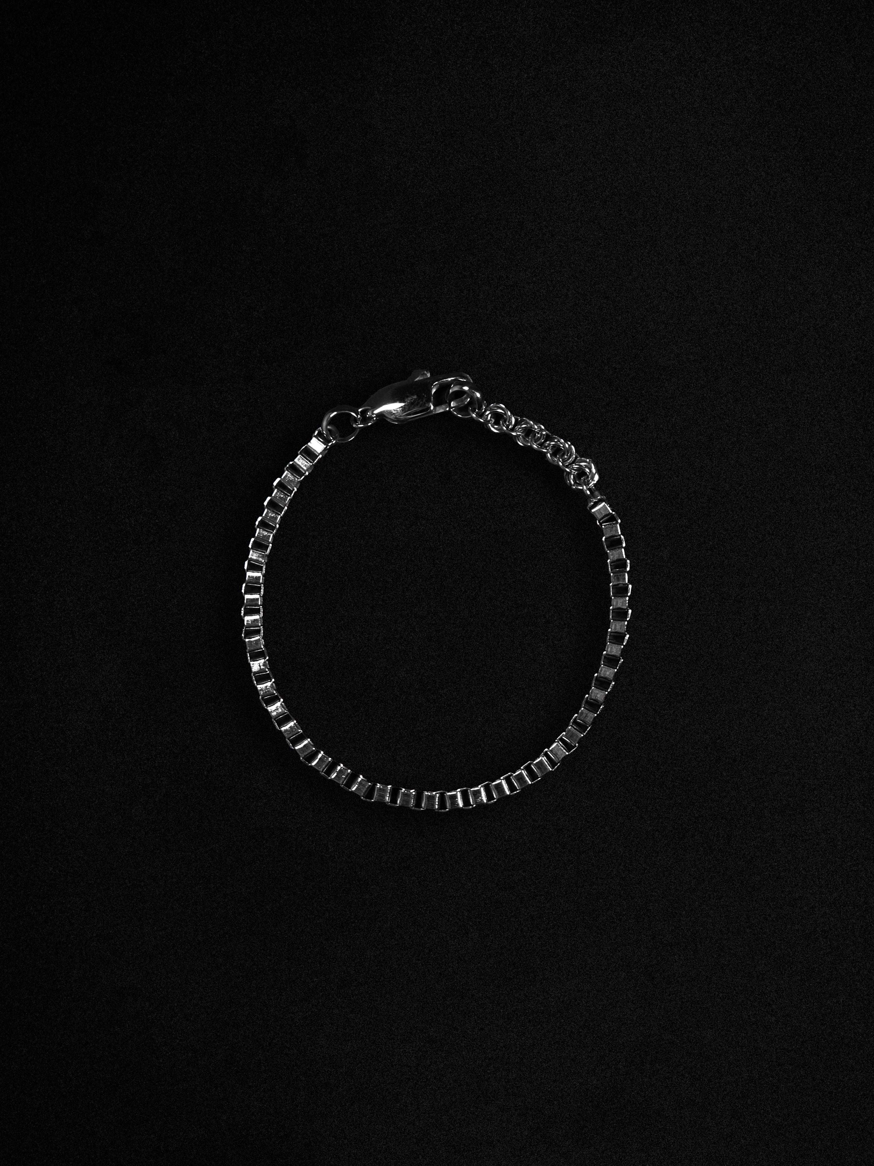 Silver bracelet on a black background