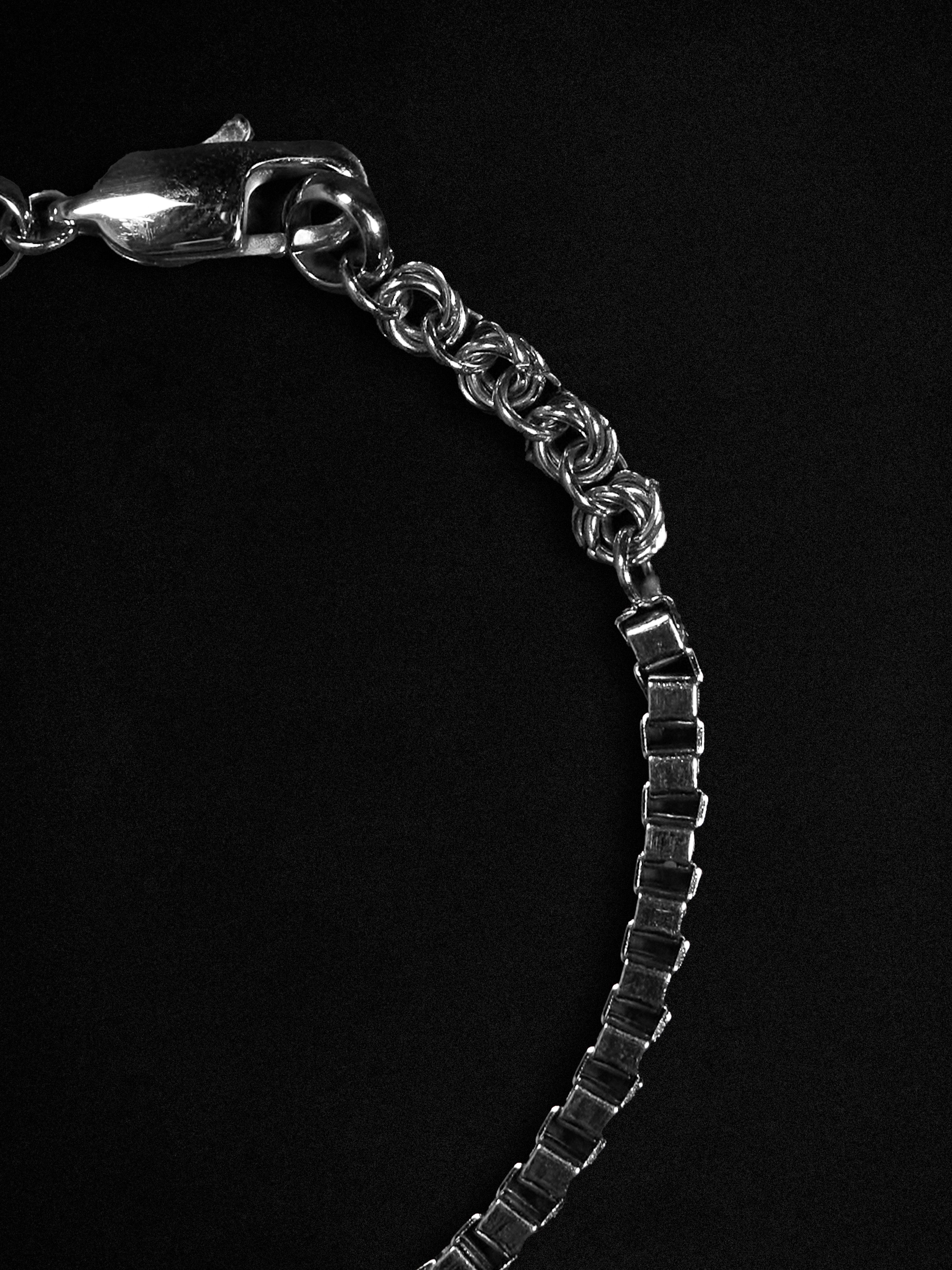 Silver bracelet on a black background