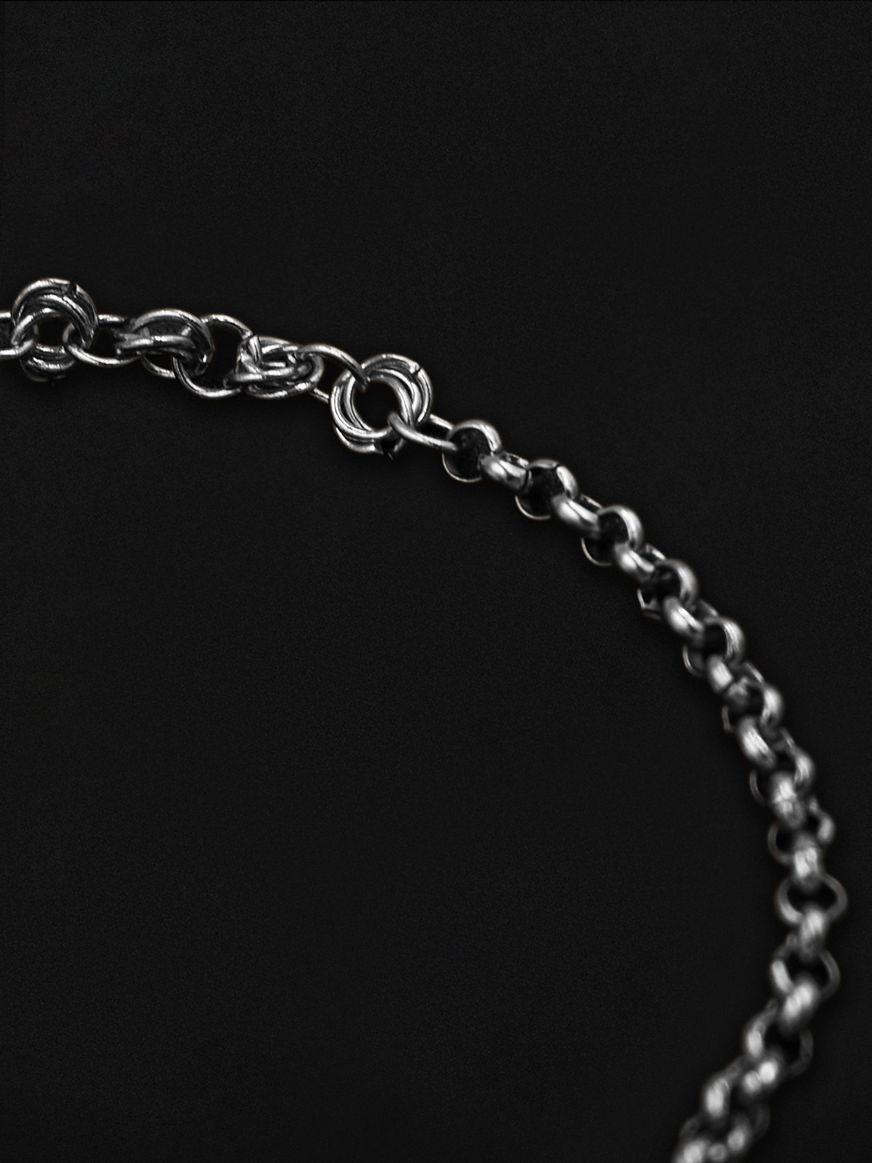 Silver chain on a black background