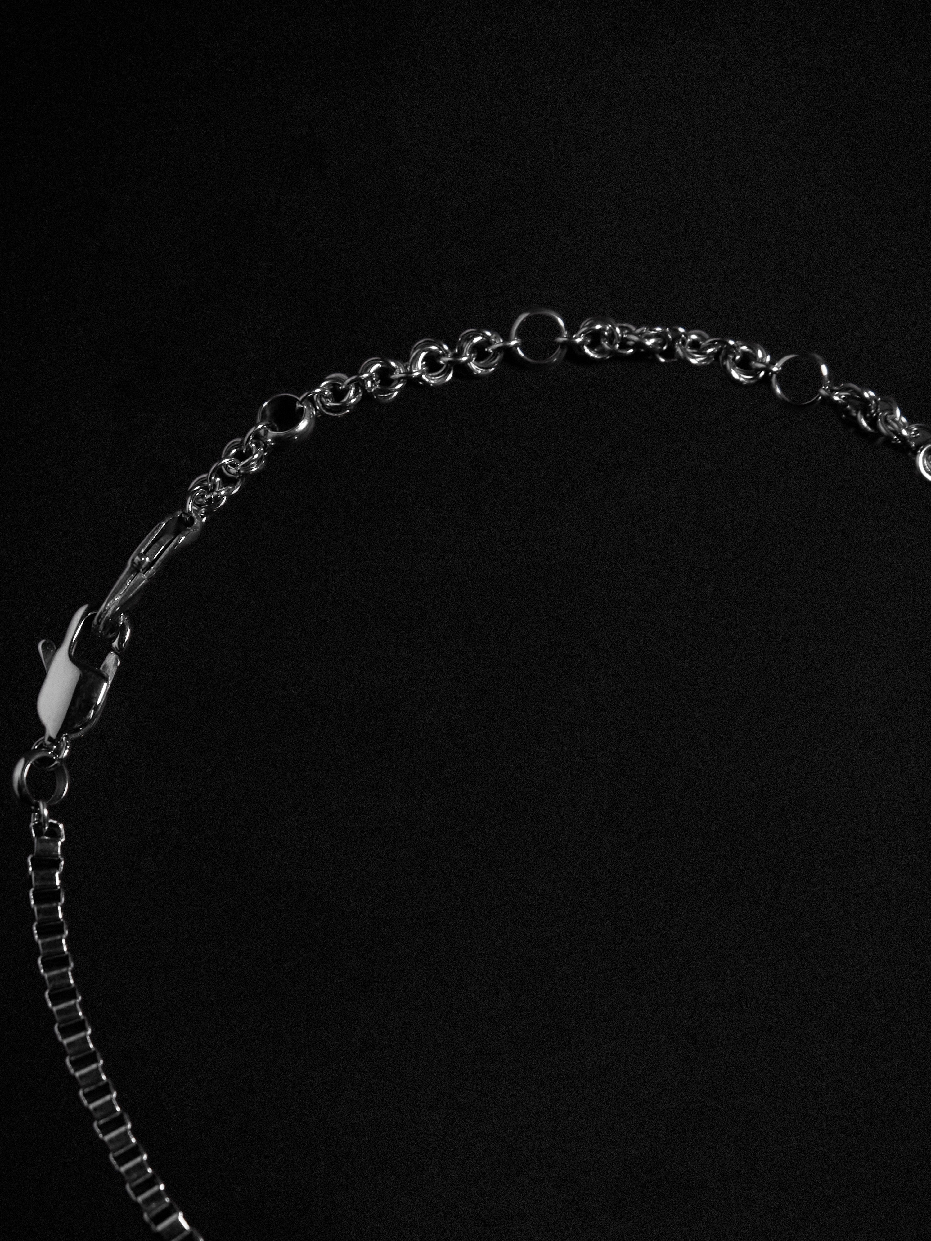 Silver chain close-up on a black background