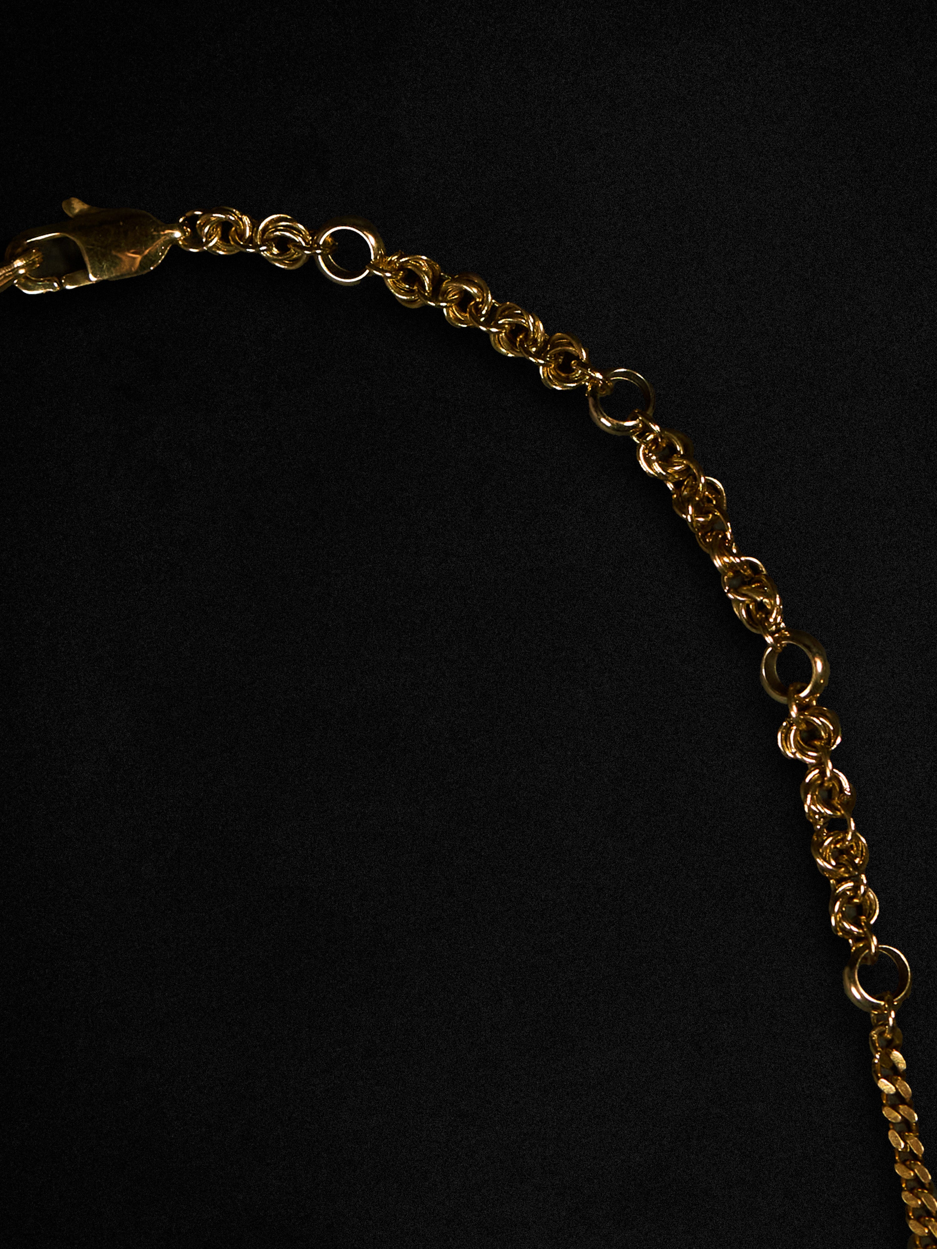 Gold chain on a black background