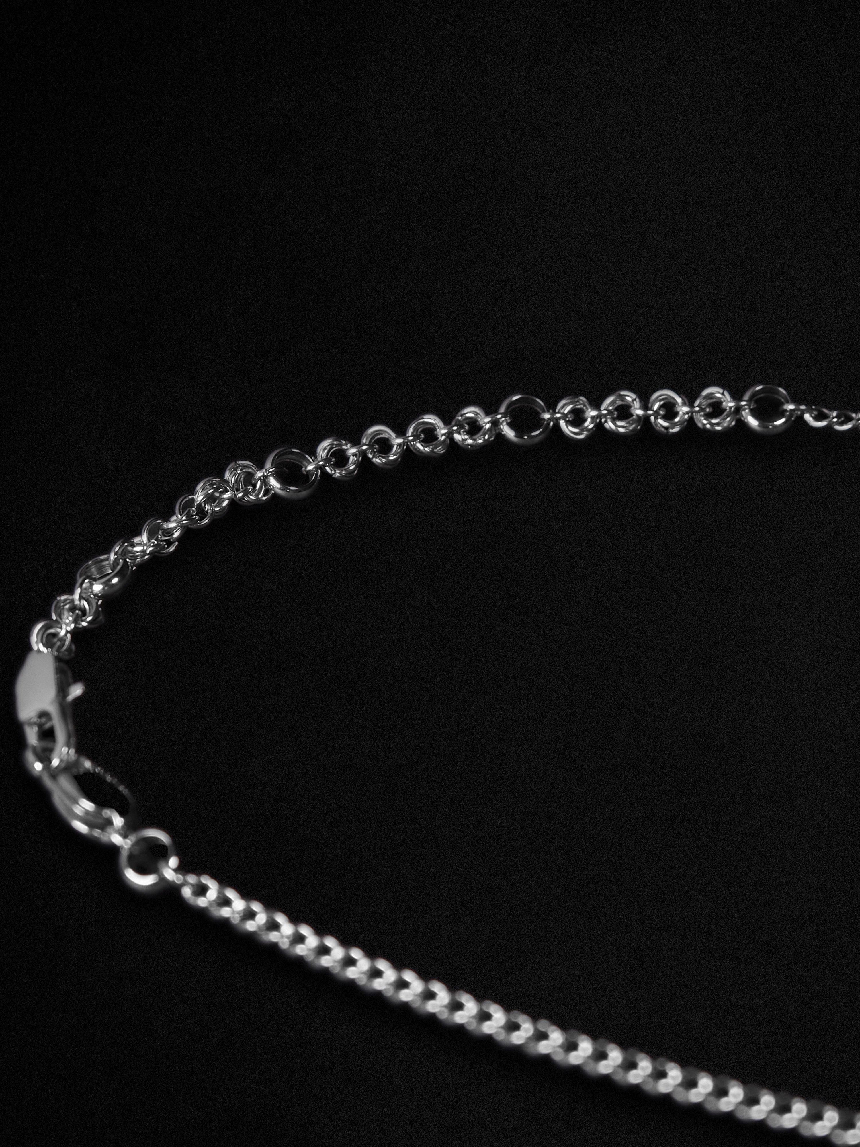 Silver chain on a black background